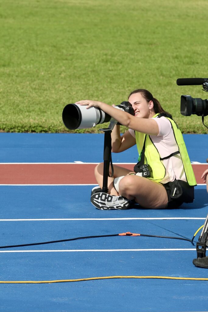 School of Journalism and Media student Avery Bane taking pictures at the 2024 US Paralympic Team Trials - Track and Field in July for USA TODAY